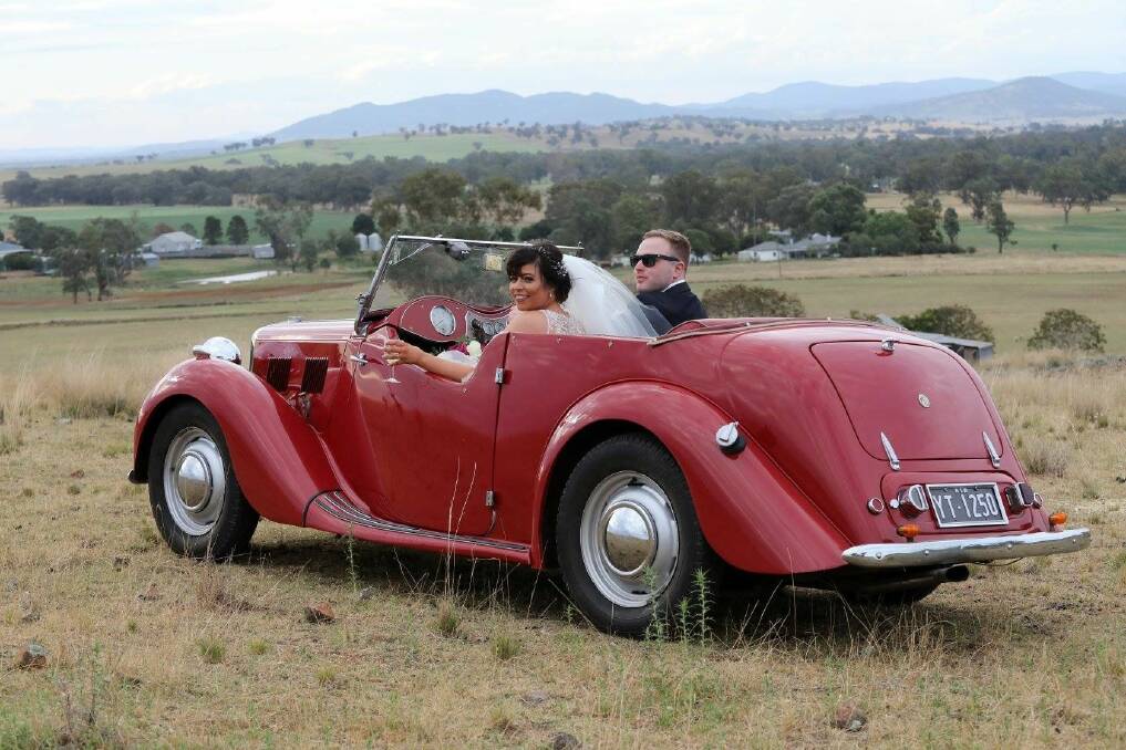 Mr and Mrs Brady take a drive in the vintage wedding vehicle.