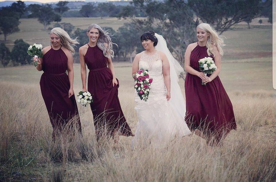 The bride Mandy-Lee and her bridesmaids Suzanne Woodbury, Sarah Fenn and Brittni Wann looked stunning in their weddings pictures, taken on a farm in Loomberah.
