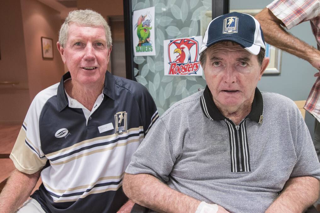 Star performer: Vic Duncan (right, pictured with John O'Meagher) proved the top of the class when it came to the Men of League's trivia contest. Photo: Peter Hardin