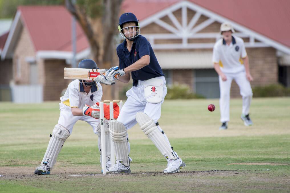 Preparing to launch: Oxley High batsman Jock Allis gets back in his crease as he looks to play this short ball against Carinya-McCarthy. 170217PHH063