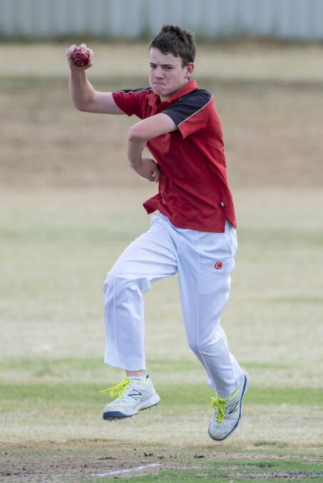 Come in spinner: Carinya-McCarthy leggie James Wallace trundles in to bowl during his side's TDCA Year 9-10 showdown against Oxley High on Friday night. 170217PHH112