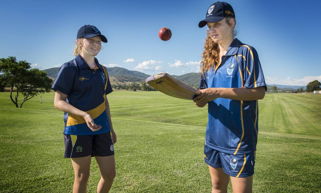 National joy: Tamworth cricketers Lara Graham, 14, and Jess Davidson, 13, starred for ACT-NSW Country. Photo: Peter Hardin 310117PHB028