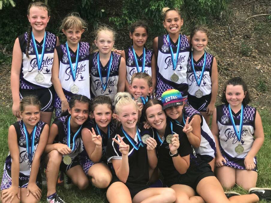 Silver sensations: Tamworth's 11 years girls team, coached by Abby Schmiedel and Brodii Ingram finished second at the NSW Oztag Championships in Coffs Harbour.