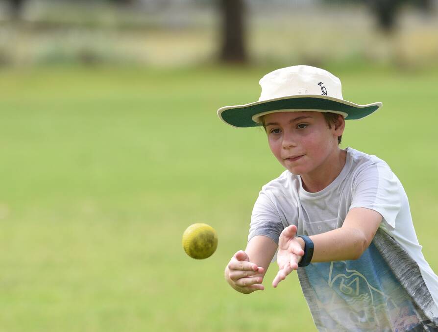 Eyes on the prize: Lachlan Thompson shows great technique in the field to swoop on this ball. Photo: Gareth Gardner 200117GGA03