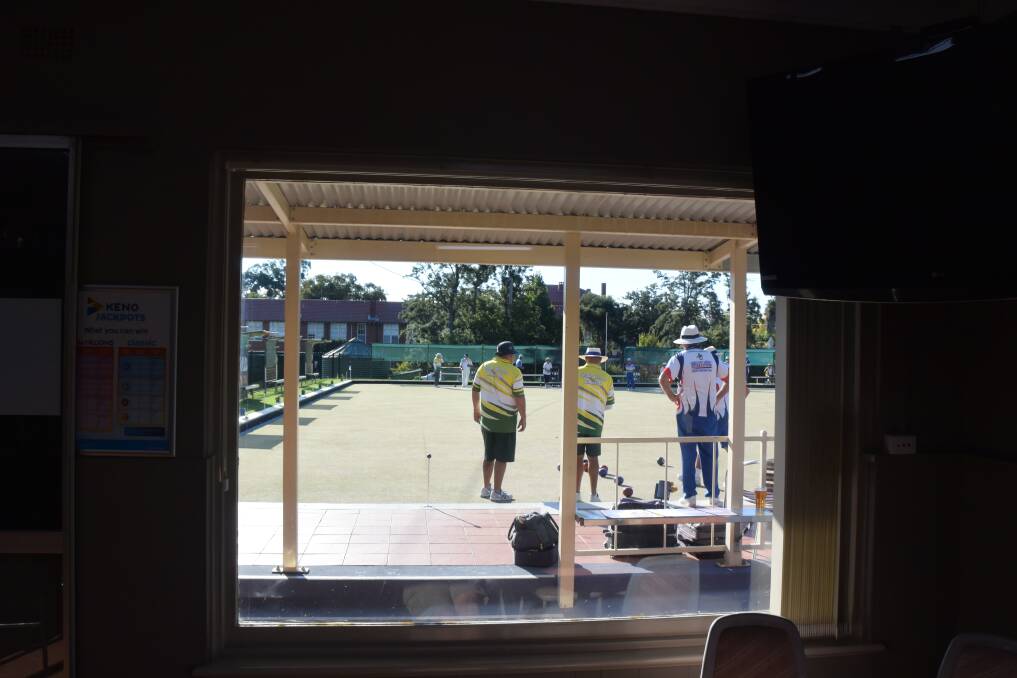 Looking through the window: The view from inside the Tamworth City Bowling Club during the John Gleeson Open Triples on Sunday.