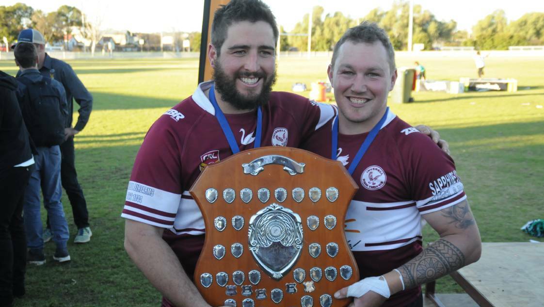 Inverell Hawks skipper Alex McCosker and grand final player-of-the-match award winner Guy Mepham savour another premiership in 2016.
