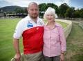 Tamworth Swans president Josh McKenzie with Griffiths' widow, Veronica, who remains involved with the club to this day. Behind them is the Gerry Griffiths end at No. 1 Oval. Picture by Peter Hardin. 