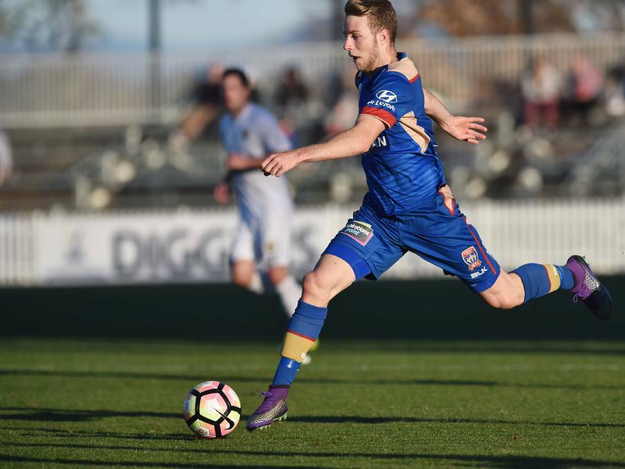 Stretching out: Andrew Hoole in full flight for the Newcastle Jets during last year's pre-season trial in Tamworth. The Jets are returning next month. Photo: Gareth Gardner