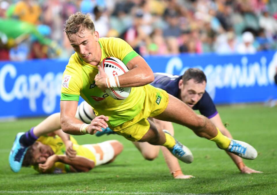 John Porch, here in action at the Sydney Sevens, scored a sensational hat-trick against the USA. Photo: AAP Image