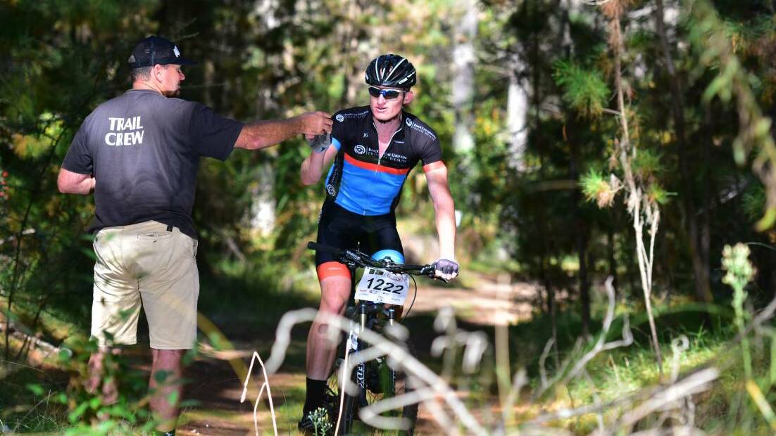 New challenge: Mick Sherwood refuels during his UNE 12 Hours in the Piney victory last year. The Tamworth cyclist will race in the Expert men at this weekend's Cross Country National Championships.