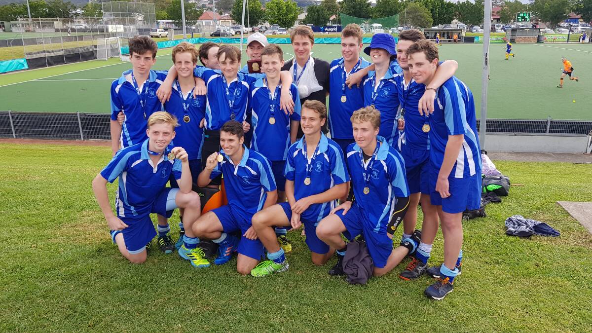 All smiles: The victorious New England side following their two-goal win over Grafton to be crowned U18s boys Division 2 state champions.