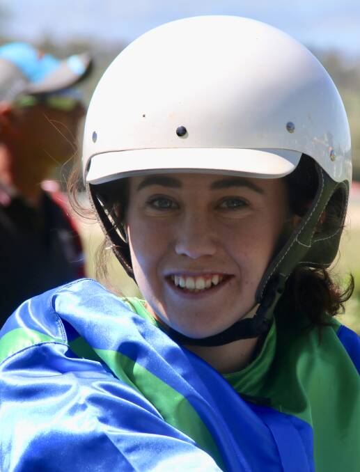 Emma Ison is all smiles after driving her first winner. Photo: Coffee Photography