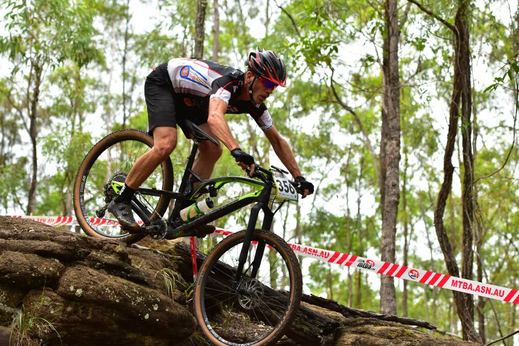 Winning ride: David Harris negotiates this tough descent on his his way to the National Masters 5 Men title at Queensland last weekend.