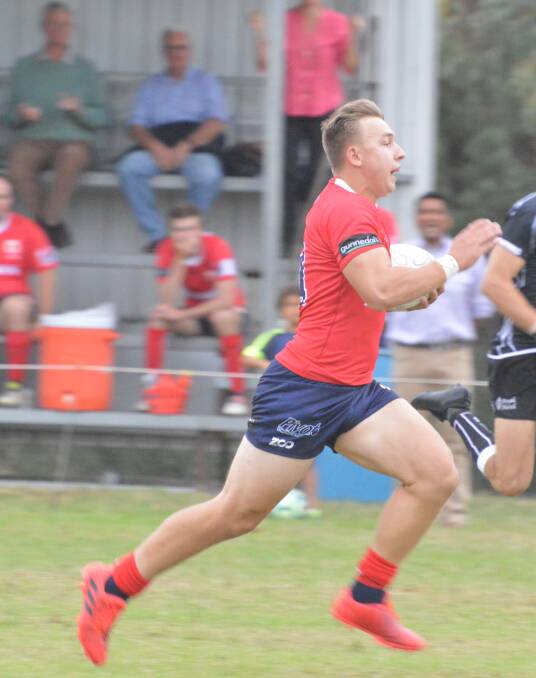 Runaway: Gunnedah winger Peter Ford races away to score the Red Devils opening try in their 21-all season opening draw with Moree on Saturday.