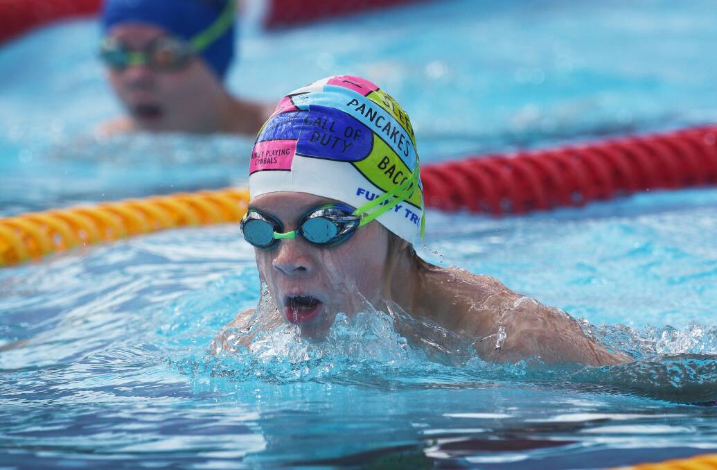 Keeping stroke: Armidale's Charlie Bailey comes up for air during his breaststroke event at Sunday's carnival. Photo: Gareth Gardner 150117GGB13