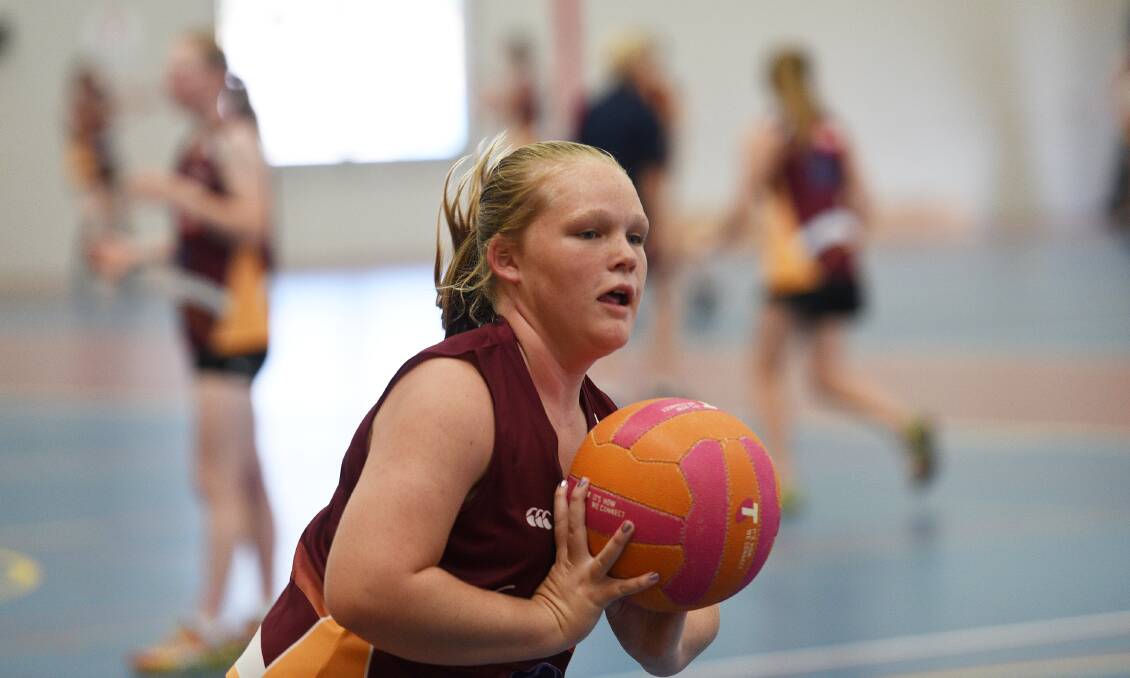 On the ball: Glen Innes' Annaleese Cameron practises her passing skills during the first regional training day for 2017. Photo: Gareth Gardner 120217GGB02