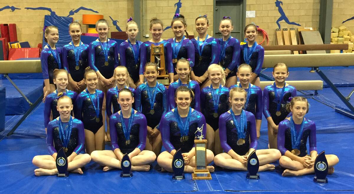 Top score: Tamworth Gymnastics Club gymnasts show off their trophy and medal haul from their recent championship endeavours.