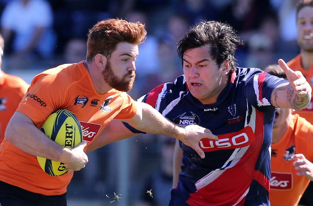 Country Eagles fullback Andrew Kellaway brushes off Melbourne Risings' Tyrel Lomax during Saturday's NRC semi-final. Photo by Ashley Feder/Getty Images.