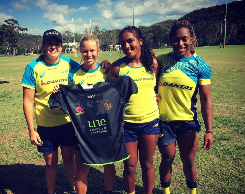 Exciting times: Members of the Aussie Pearls show off the UNE jersey. UNE Lions coaching staff recently spent some time with the Pearls ahead of the start of the Lions' program. 