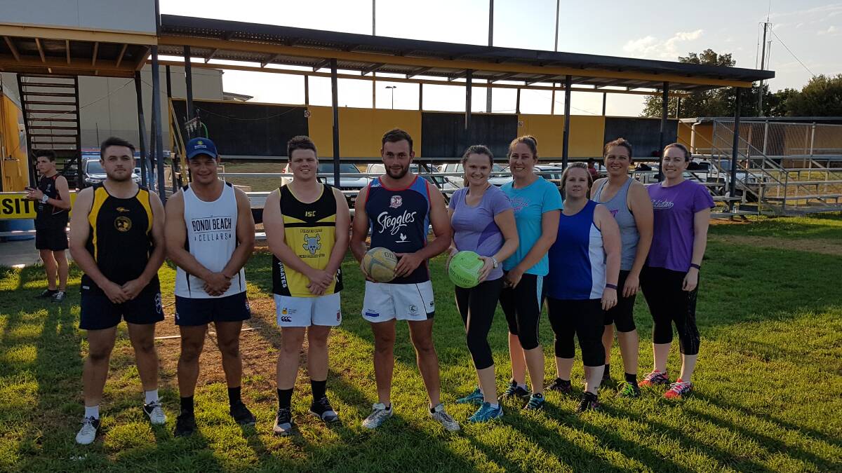Courting a new venture: Players from the new Pirates Westview Netball Club with some of the Pirates players during a recent training session.