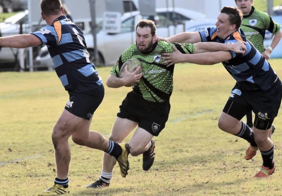 Big job: Tamworth's Lachlan McIntosh looks to brush off the Scone defence last season. McIntosh will start on the wing against Walcha on Saturday in what will be a big test for the Magpies. Photo: Geoff O'Neill.