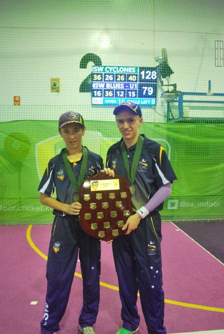 Winners: Matt Holmes (L) and Zac Clarke (R) hold the shield they helped the NSW Cyclones 13&U boys secure at Mackay recently.