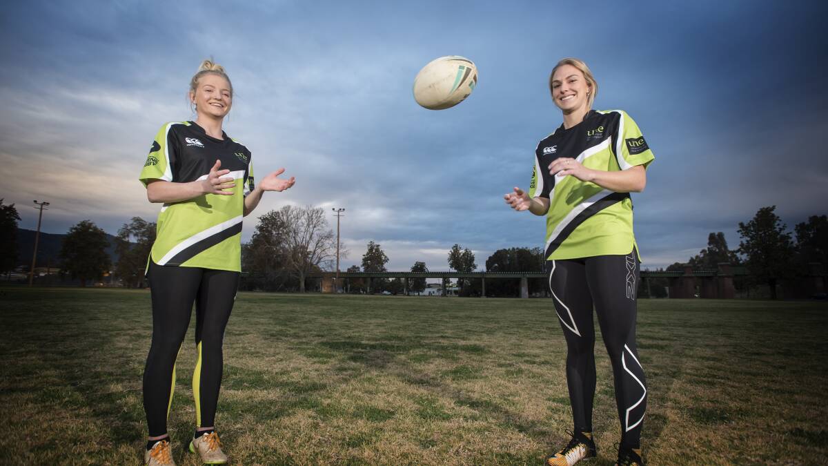 LEARNING CURVE: Rugby novices Abby Schmiedel (left) and Kim Resch will play for the UNE Lions at this weekend's inaugural Uni 7s round. Photo: Peter Hardin 