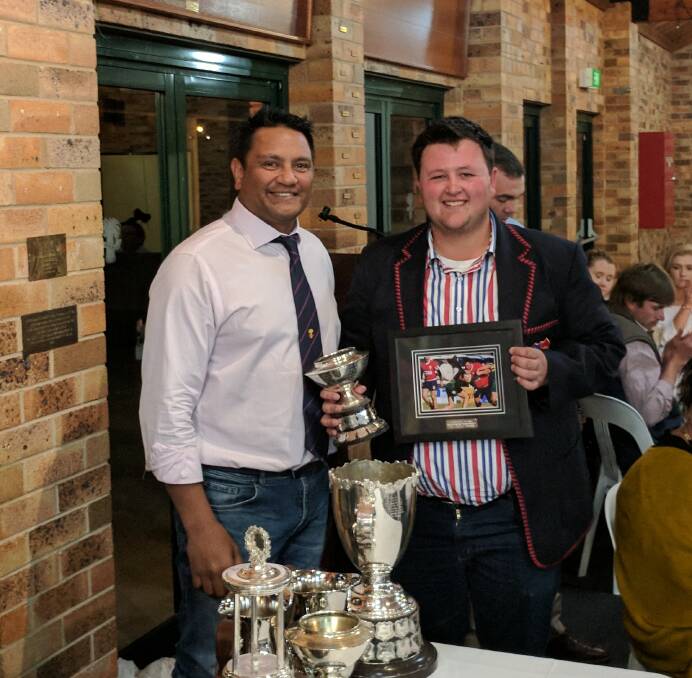 Russell Johnston (right) won the award for most improved first grade player.