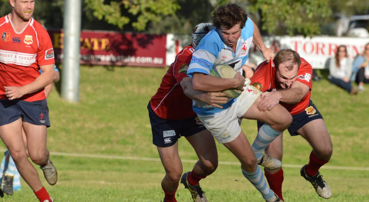 Powering through: Quirindi outside centre James Clift tries to break through the Gunnedah defence during the Lions big win on Saturday. 