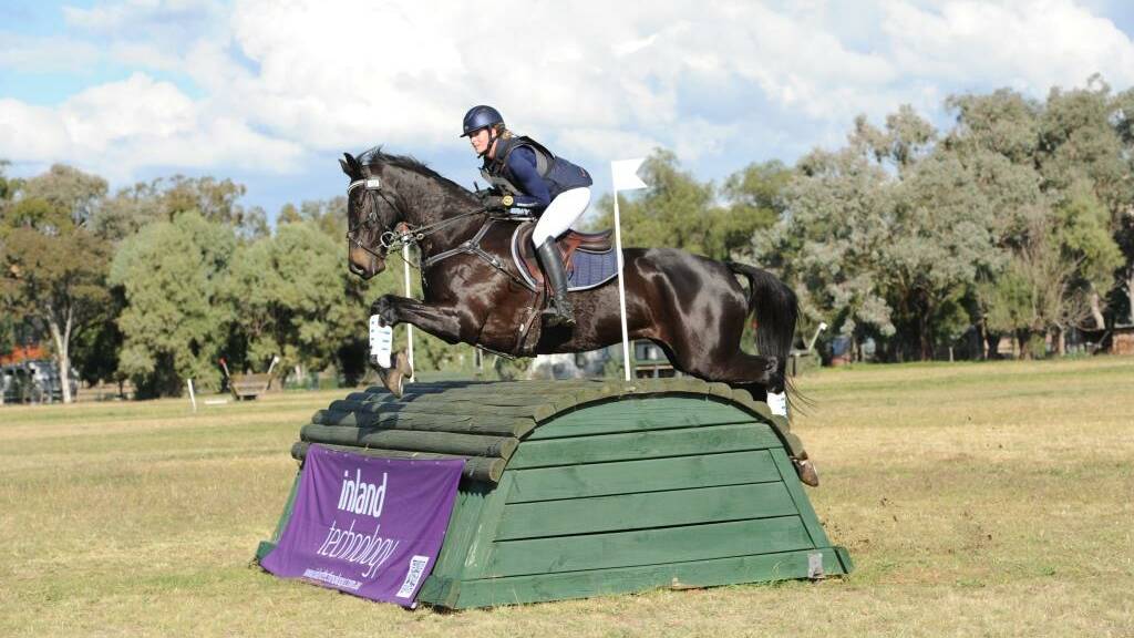 Riding high: Jessica Rae and Rascal clear this jump on their way to winning the CNC3* class at Tamworth International Eventing’s May event on the weekend. Photo: Oz Shotz