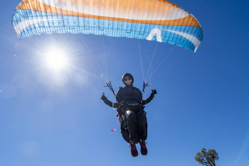 The sky is the limit: Competing for the Queensland team, Brisbane's Elissa Jack takes to the skies on the opening day of the Paragliding State of Origin. Photo: Peter Hardin