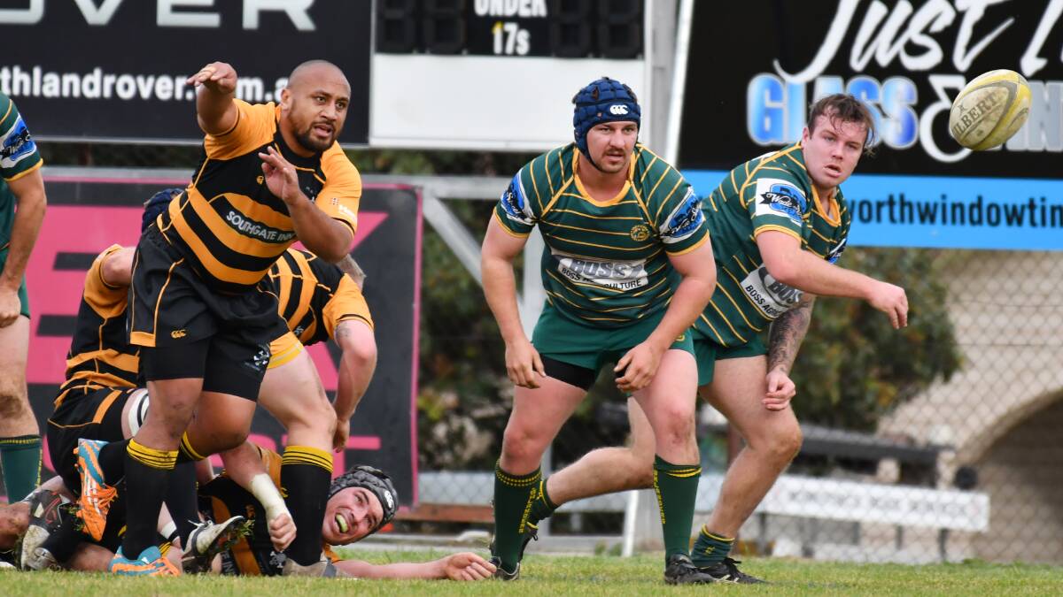 Pirates half-back Amos Ioasa fires out this pass as Inverell's Trent Hoscher and Tom Apthorpe line up in defence. Both have big games on Saturday with Pirates hosting Moree and Inverell at home to Walcha. Photo: Barry Smith. 160716BSG31