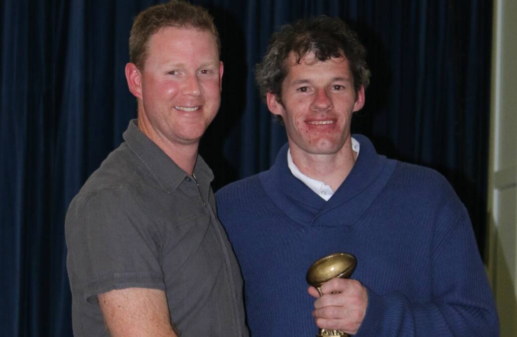 Top performer: Tamworth Swans' Stephen Fairless accepts the 2016 Sporting Pulse Award from Simon Smyth from AFL NSW/ACT.