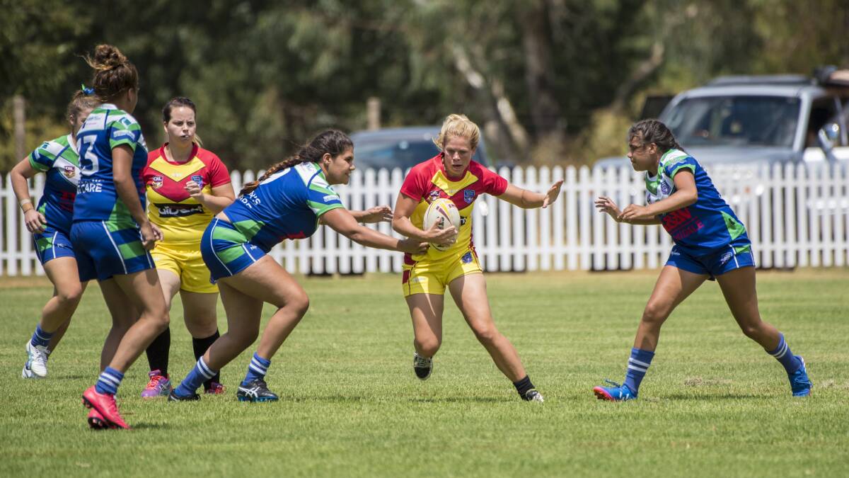 The Rebels' Kate Ferguson slices her way through the Armidale defence during their clash on Saturday. Photo: Peter Hardin