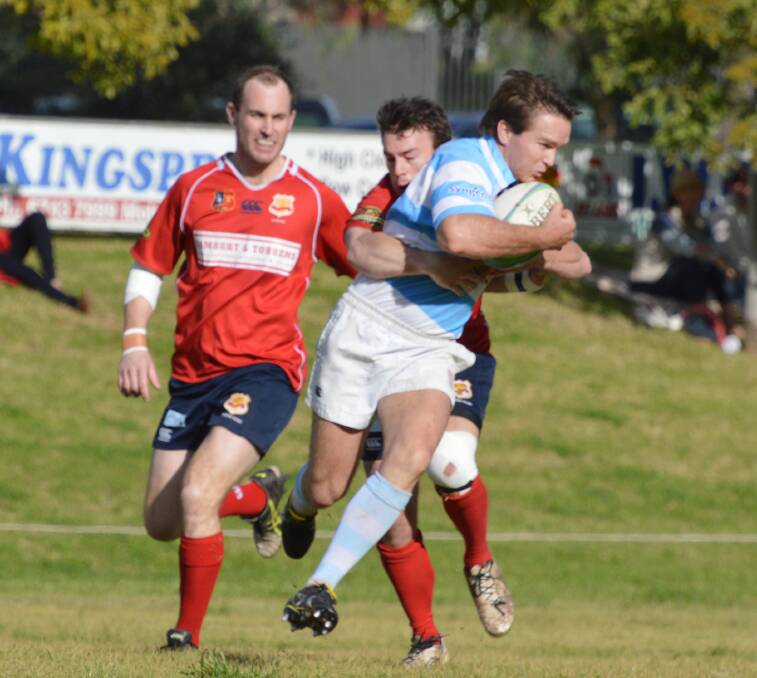 Caught: Jeremy Brown affects this tackle on an airborne Quirindi five-eighth Elliot Tourle as Adam Mooney looks on during their clash on Saturday. Photo: Samantha Newsam