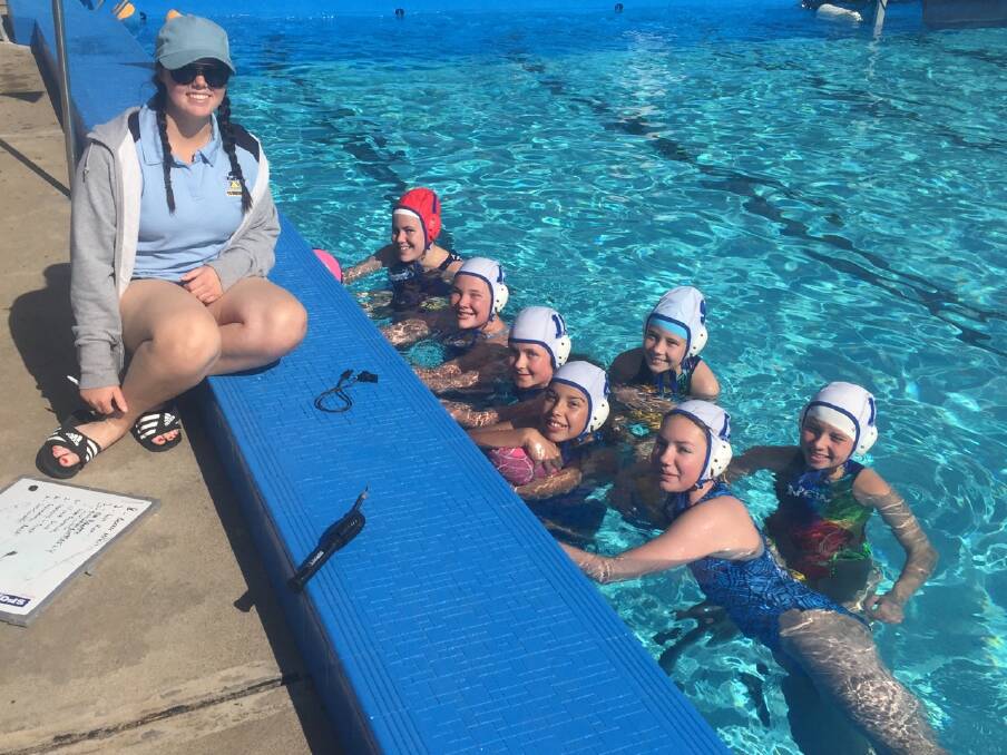 The Tamworth U14 girls, which Abby Griffiths (on pool deck) is co-coaching, are in Nowra this weekend for the Country Club Championships.