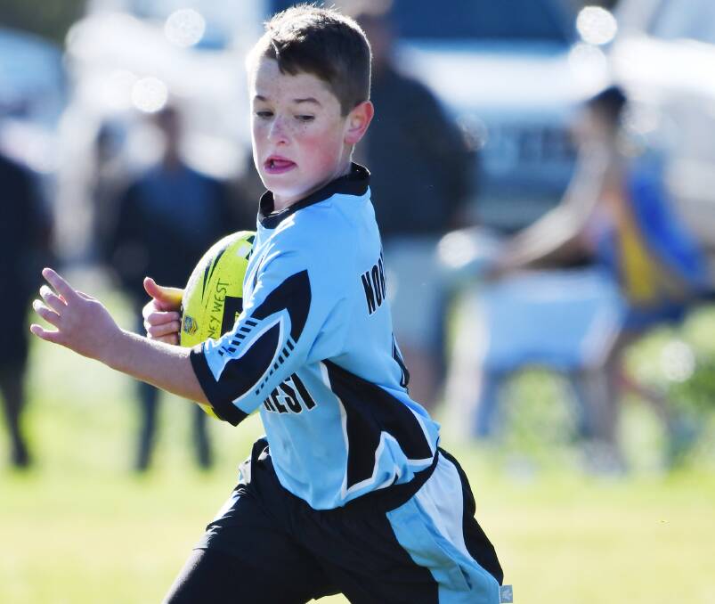 On the run: Sir Henry Parkes' Memorial's at full stretch for North West during the State PSSA Touch Championships. Photo: Barry Smith. 260716BSA10