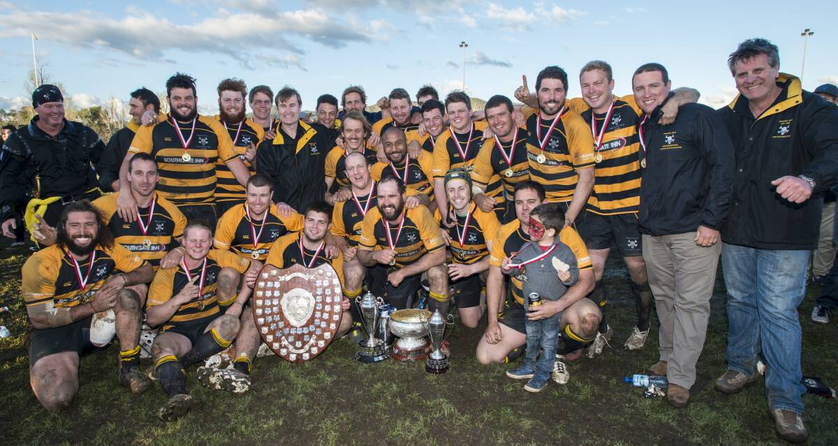 We are the champions: Pirates with the spoils of the season they capped off with a stunning grand final performance on Saturday. Photo: Peter Hardin. 030916PHC376