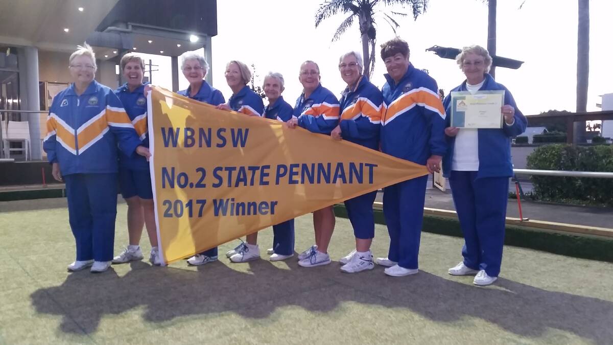 Champions: The successful West Tamworth women's side proudly hold the State Pennants flag they won at the Central Coast last week. 