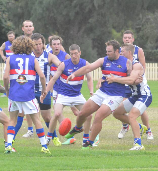 Strong game: Matt Pengilly, here getting boot to ball just in the nick of time against the Tamworth Kangaroos earlier in the season, was best on ground for Gunnedah in their big win over Inverell on Saturday.