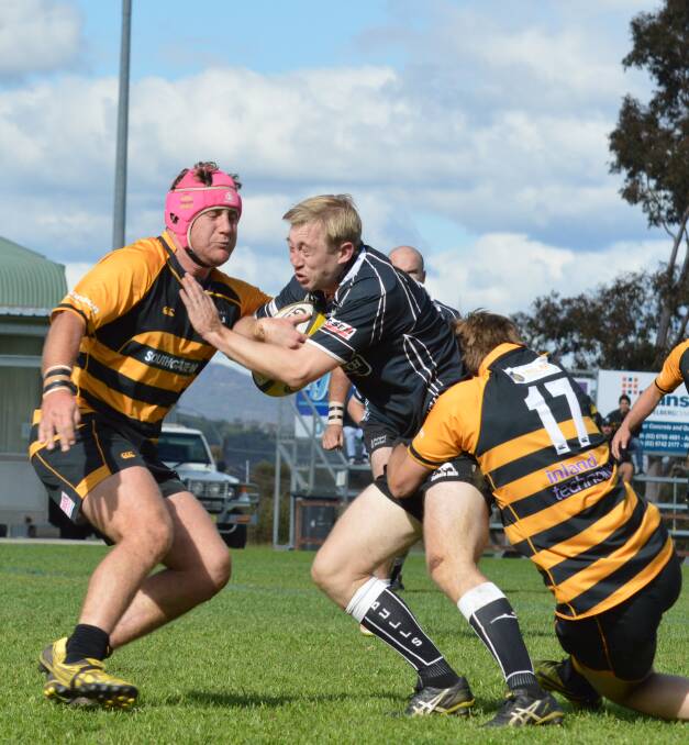 Crunch: Moree winger Sam Bacigalupo braces for impact from Pirates' Tom Shelton (17) and Jacob Budd during Saturday's second grade major semi-final.