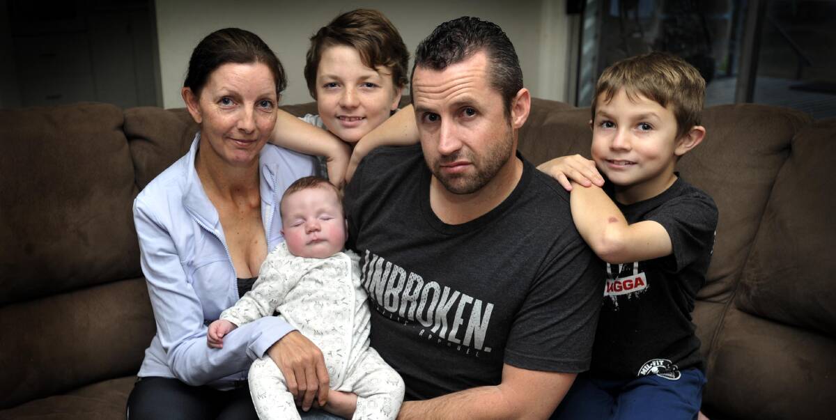 KEEP ON GOING: Brad Fewson will travel to the United States for a check-up on his injury and treatment. Pictured with his family, wife Laura Fewson, CJ Fewson, Jack Fewson and George Fewson.