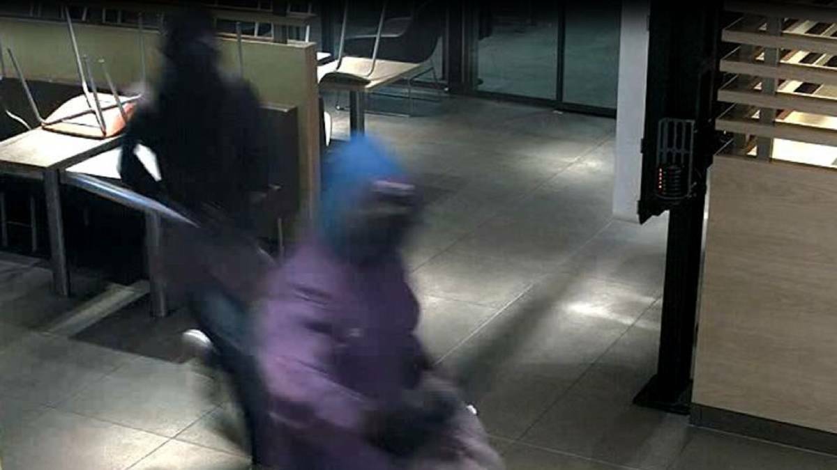 GRAINY: Security vision shows two of the armed robbers who held up the McDonald's restaurant at Williamtown armed with guns and baseball bats on January 25. Picture: NSW Police.
