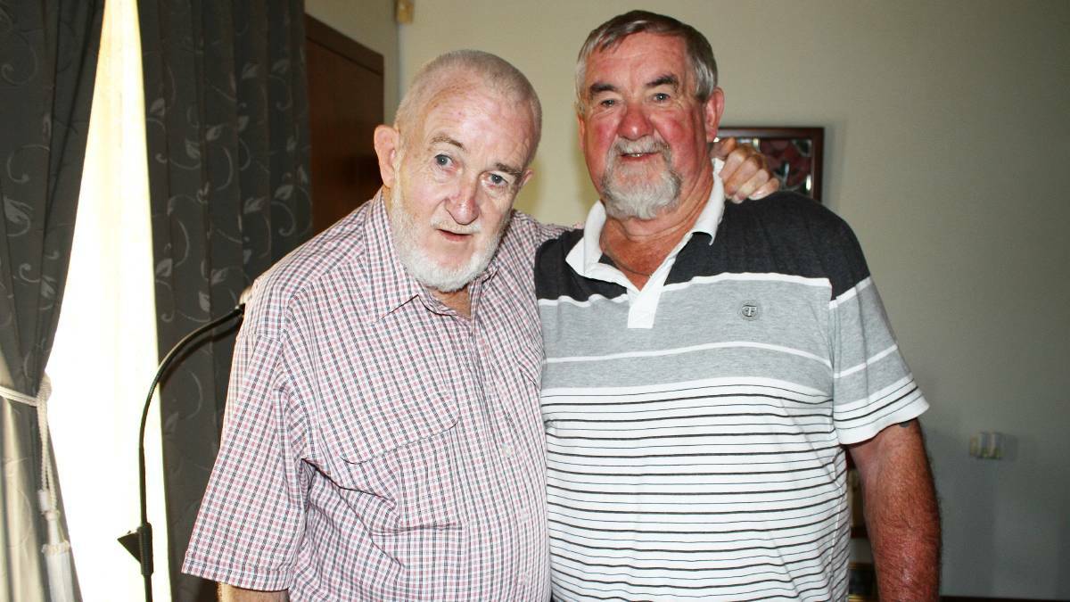 REUNITED: Frank Hunt hugs Bill Wilcox, the man who saved his life in the Long Hai mountains of Vietnam 48 years ago. Picture: Alasdair McDonald
