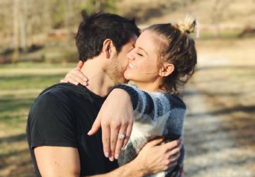 Engaged: Morgan Evans and Kelsea Ballerini in a post from Evans' Facebook page, with Ballerini showing the engagement ring.