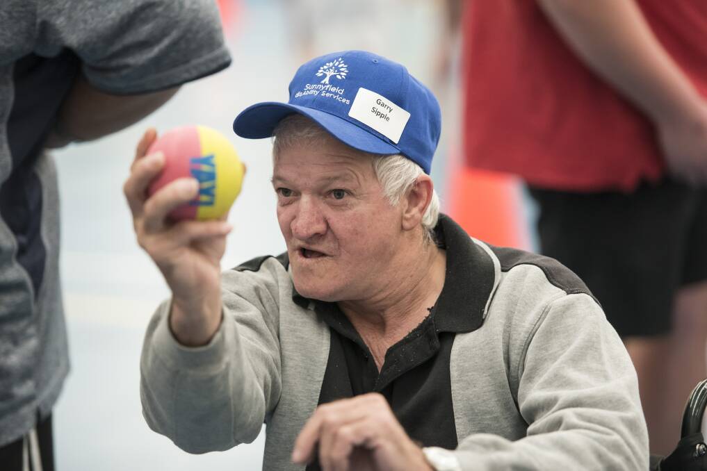 AIMING UP: Garry Sipple, one of more than 100 clients from around the region, having a ball at the annual Sunnyfield sports day in Tamworth this week. Photo: Peter Hardin 160817PHB029