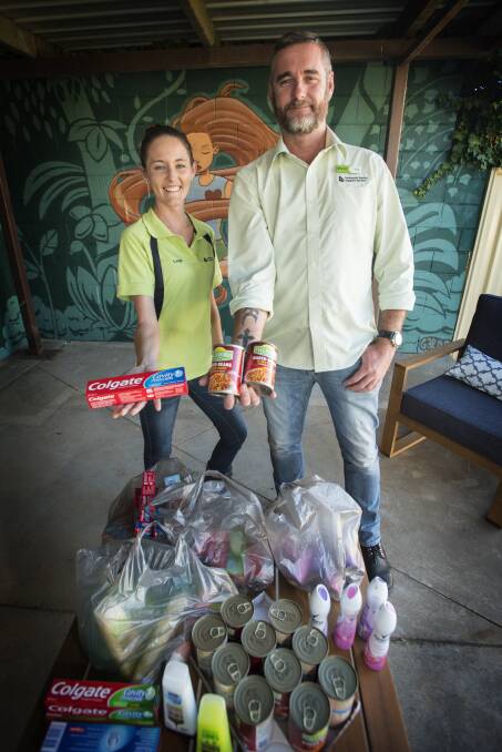 CARE FACTOR: Leigh Wagstaff and Brett Goodchild from Tamworth Family Support Service with care packages for the city's homeless youth. Photo: Peter Hardin 040417PHB019