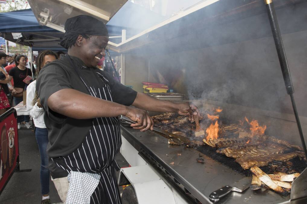 IN HOT DEMAND: Elliot Dube from Brisbane St restaurant Safari Club sizzled up some highly sought after meaty meals at Fiesta La Peel. Photo: Peter Hardin 141017PHD062