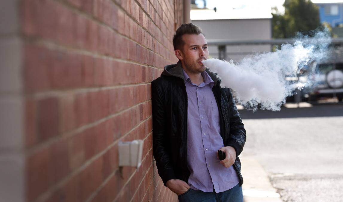 UP IN SMOKE: Nick Grimes said he used an e-cigarette to quit smoking. Photo: Gareth Gardner 310517GGC01