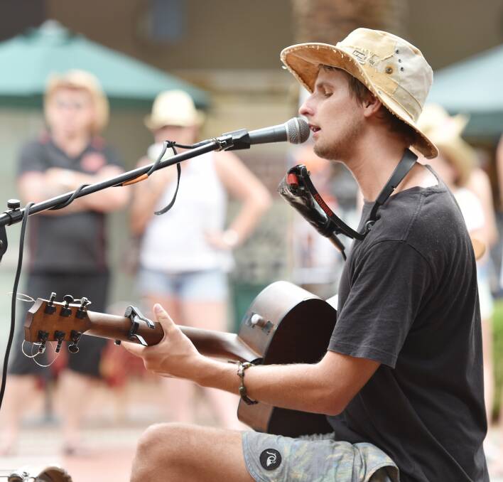 KING OF THE BUSKERS: Queensland's Mitch King was crowned 2016 country music festival's busking champion. Photo: Geoff O'Neill 210116GOA09